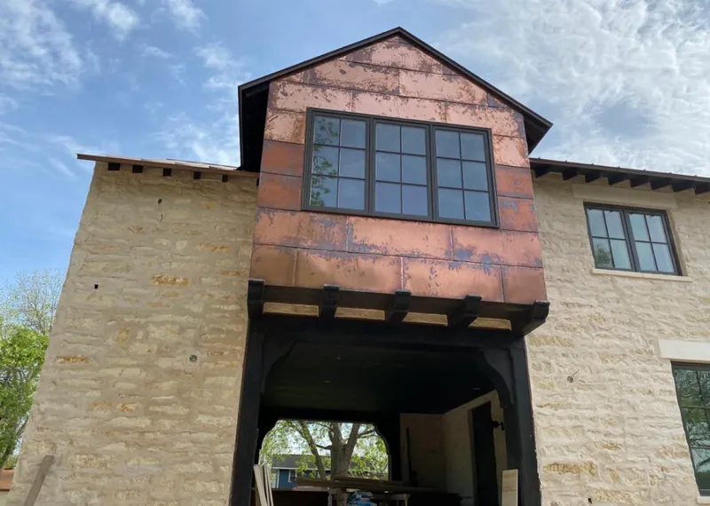 Copper metal panel facade on a stone building for Skylight Installation in Spokane Valley