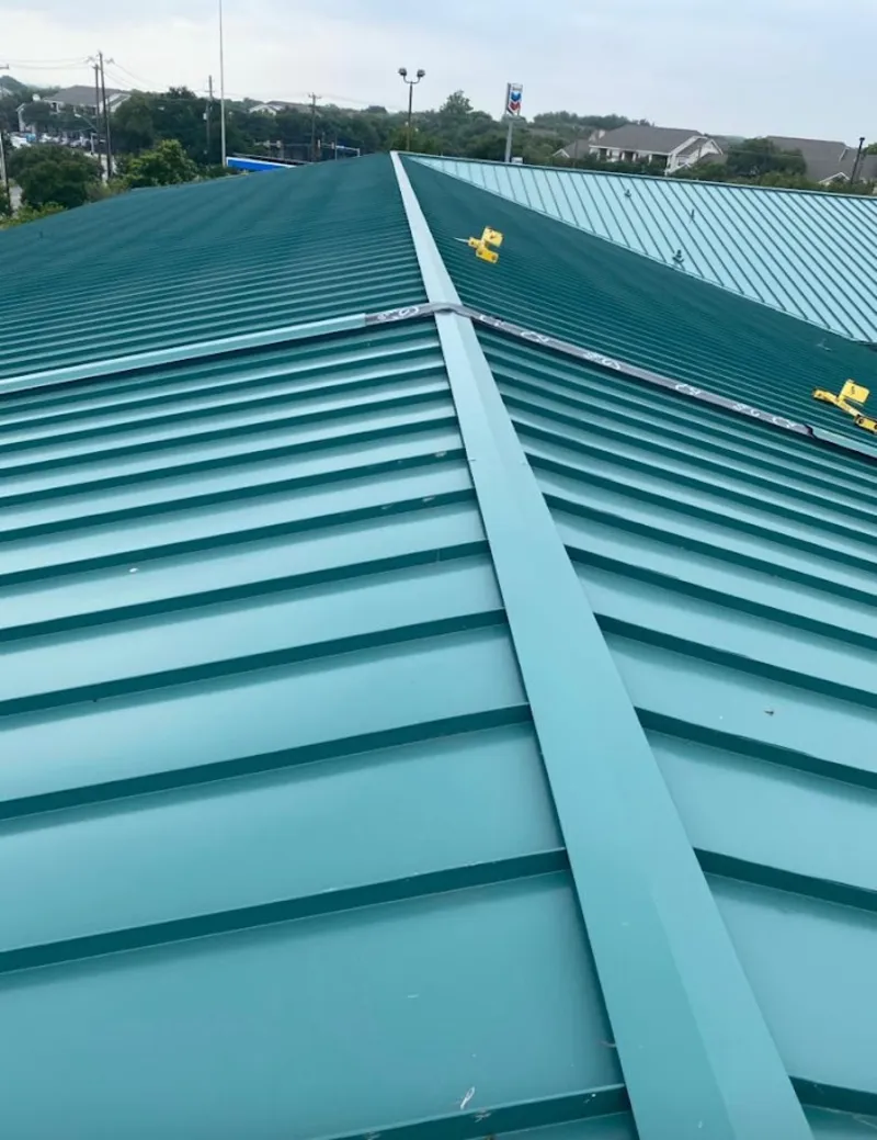 Green commercial metal roof ridge and valley for Metal Roof Repair in Spokane Valley